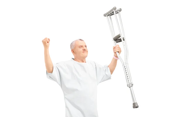 Mature patient holding crutches — Stock Photo, Image