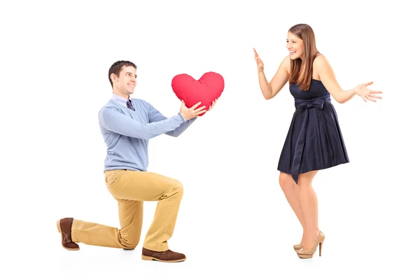 Male kneeling with heart to woman — Stock Photo, Image