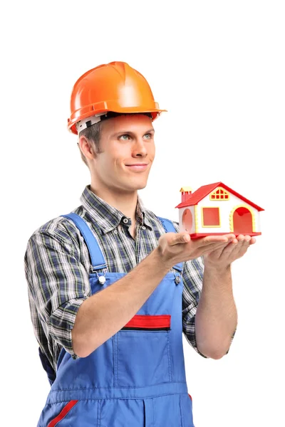 Male construction holding model house — Stock Photo, Image