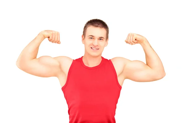 Muscular guy showing his muscles — Stock Photo, Image