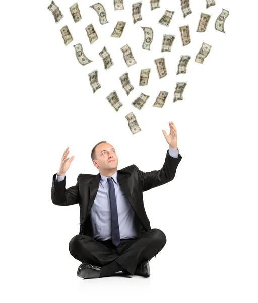 Money falling into hands of businessman — Stock Photo, Image