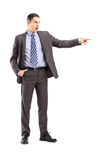 Angry businessman pointing with finger — Stock Photo, Image