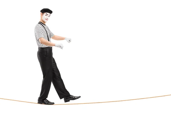 Male mime artist walking on rope — Stock Photo, Image