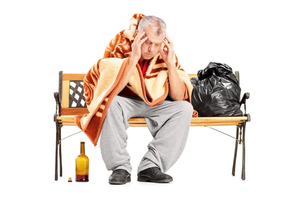 Disappointed homeless man on bench — Stock Photo, Image