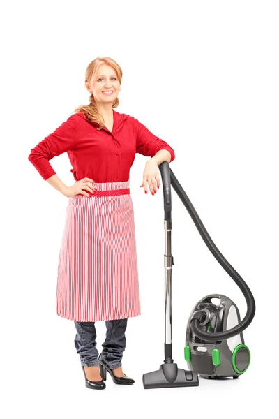 Housewife on vacuum cleaner — Stock Photo, Image