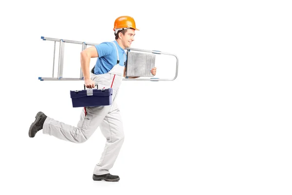 Repairman running with ladder — Stock Photo, Image