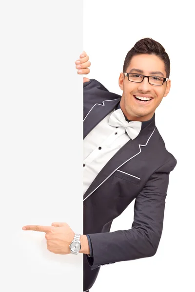 Guy pointing with finger on panel — Stock Photo, Image