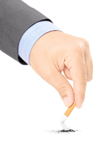 Male hand quitting smoking cigarette — Stock Photo, Image