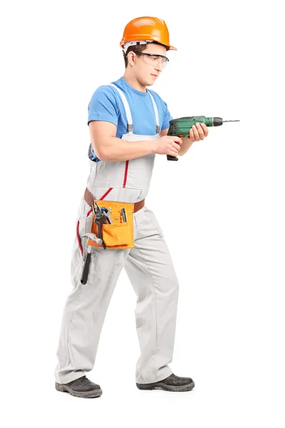 Robotnik przy użyciu narzędzia Wiertarka — Zdjęcie stockowe