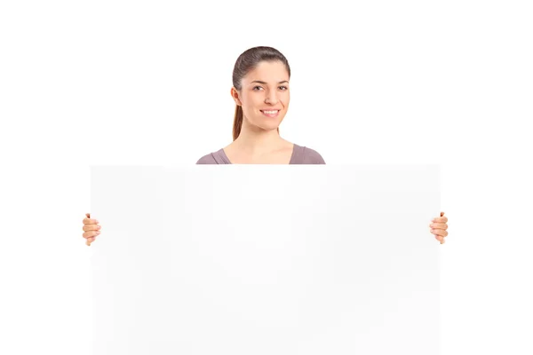 Woman holding blank billboard — Stock Photo, Image