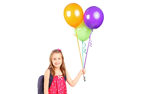 Kız holding grup balonlar — Stok fotoğraf