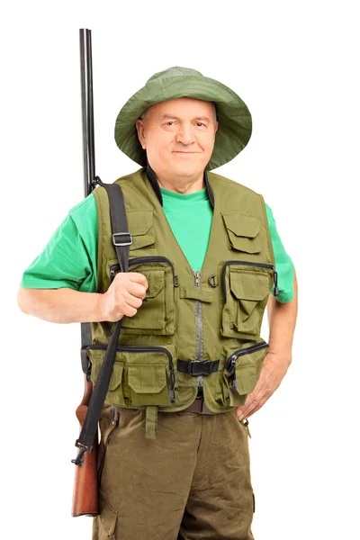 Mature hunter holding rifle — Stock Photo, Image