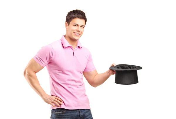 Smiling man holding top hat — Stock Photo, Image