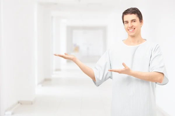 Male patient wearing hospital gown — Stock Photo, Image