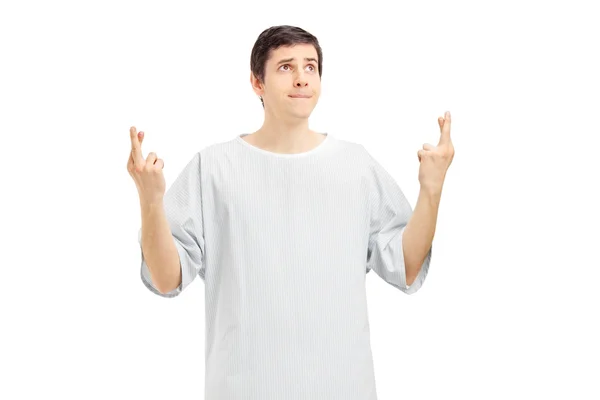 Male patient with fingers crossed — Stock Photo, Image