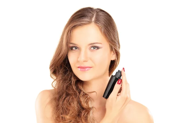 Beautiful female applying a perfume — Stock Photo, Image