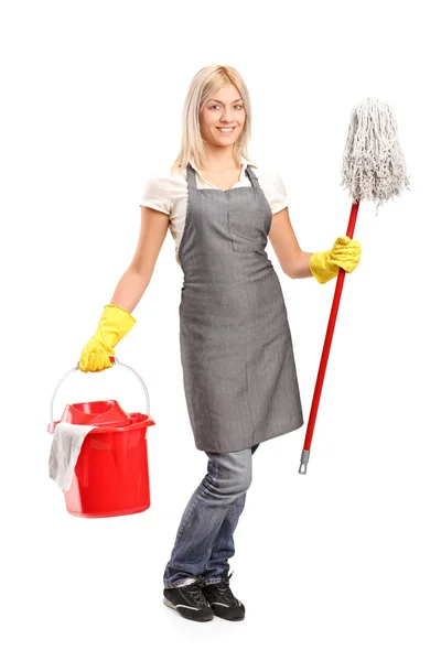 Female cleaner with cleaning supplies — Stock Photo, Image