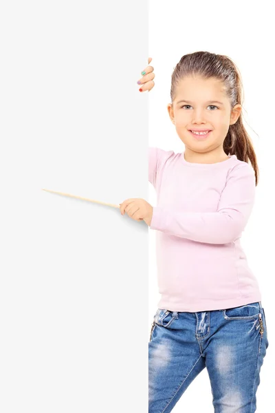 Girl pointing to blank panel — Stock Photo, Image