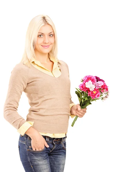 Woman holding bunch of flowers — Stock Photo, Image