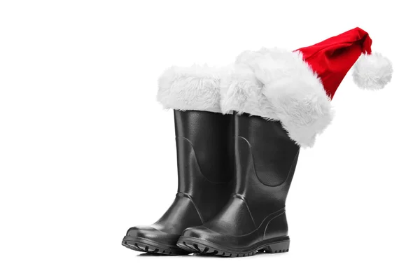 Santa buty i kapelusz santa — Zdjęcie stockowe