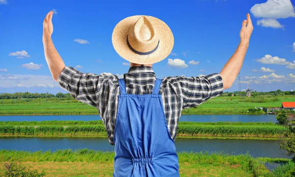 Farmer gesturing with raised hands — Stock Photo, Image