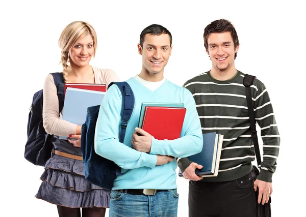 Drie studenten poseren met boeken — Stockfoto