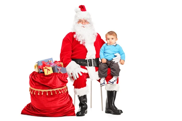 Санта-Клаус и маленький ребенок — стоковое фото