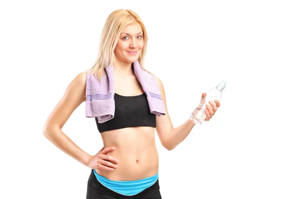 Sportswoman with bottle of water — Stock Photo, Image