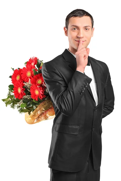 Hombre ocultando flores —  Fotos de Stock