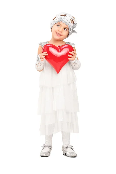 Girl holding heart and thinking — Stock Photo, Image