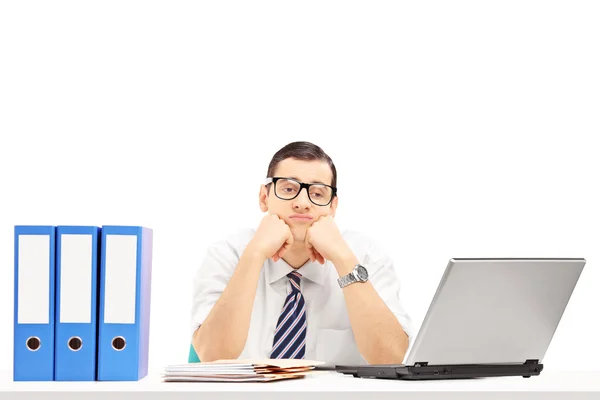 Sad young businessman in office — Stock Photo, Image