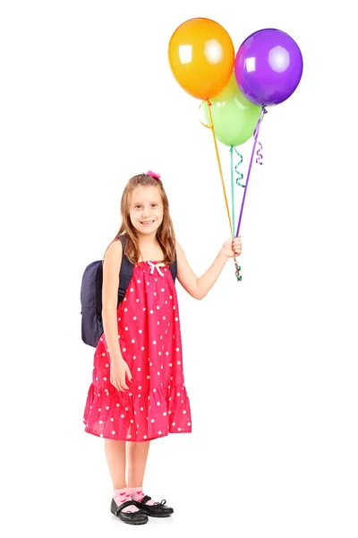 Girl holding bunch of balloons — Stock Photo, Image