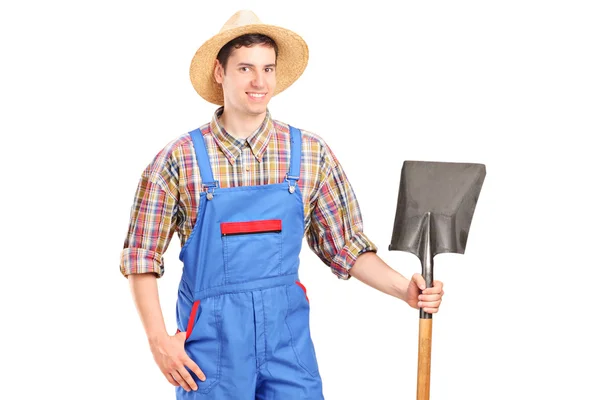 Agricultural worker holding shovel — Stock Photo, Image