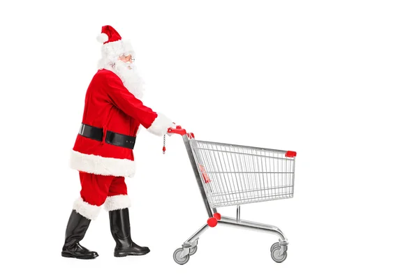 Babbo Natale spingendo carrello della spesa — Foto Stock