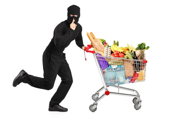 Robber stealing pushcart with products — Stock Photo, Image