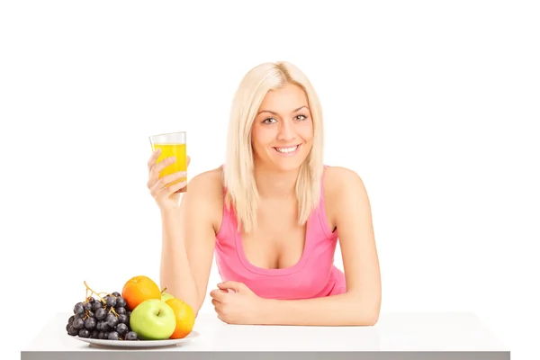 Female holding glass of juice — Stock Photo, Image