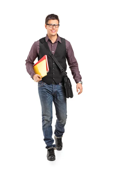 School boy walking and holding books — Stock Photo, Image