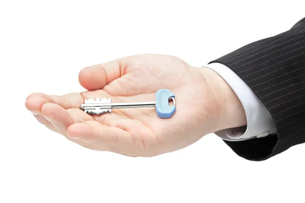 Male hand holding a door key — Stock Photo, Image
