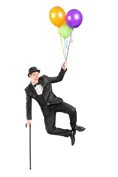 Magician holding balloons — Stock Photo, Image