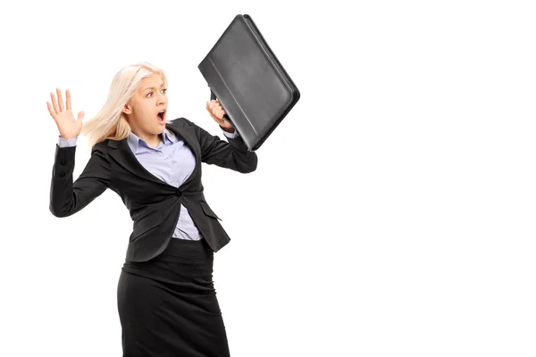 Business woman protecting with briefcase — Stock Photo, Image