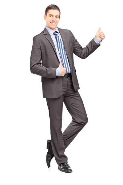 Businessman leaning against wall — Stock Photo, Image