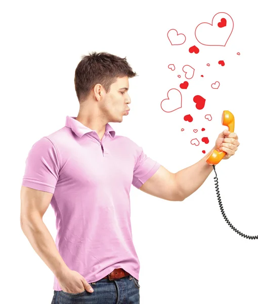 Male holding telephone, giving kisses — Stock Photo, Image