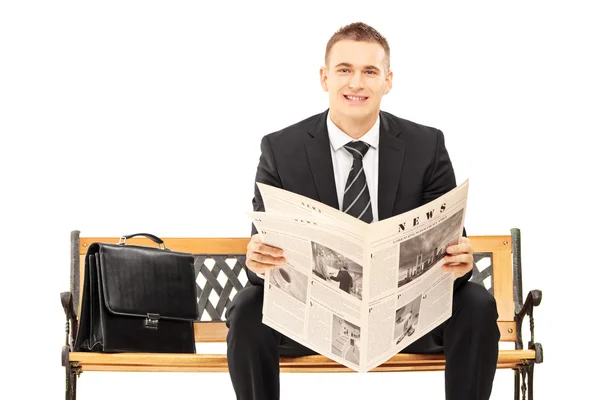 Businessman with newspaper — Stock Photo, Image