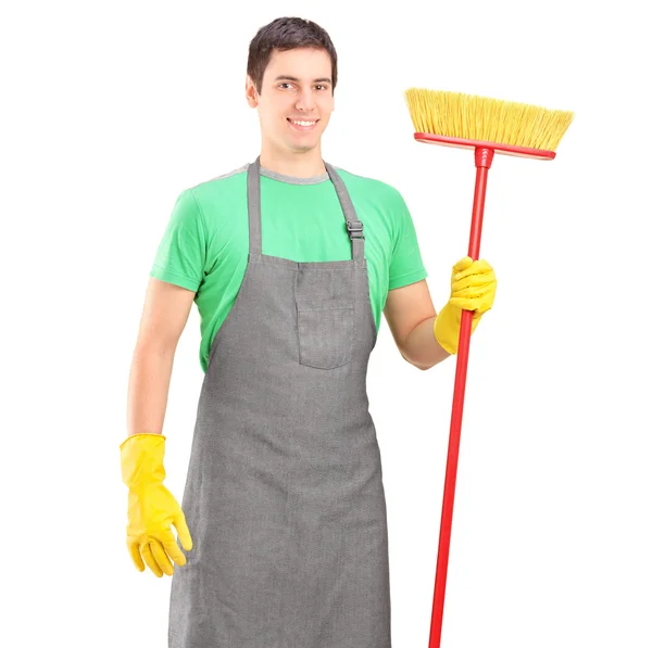 Male cleaner holding brush — Stock Photo, Image