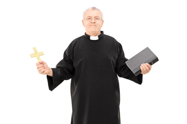 Reverend holding bible and cross