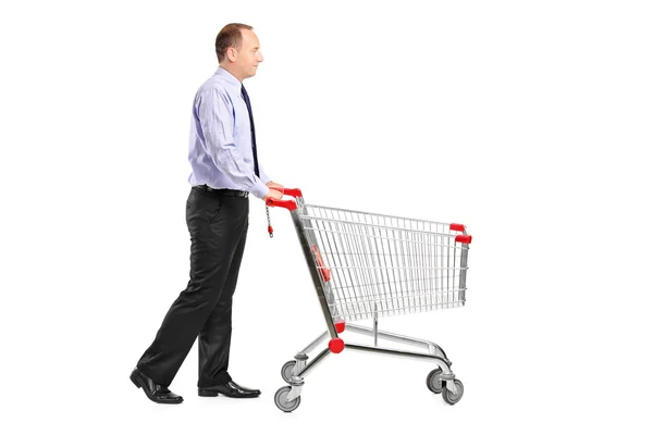 Man pushing shopping cart — Stock Photo, Image