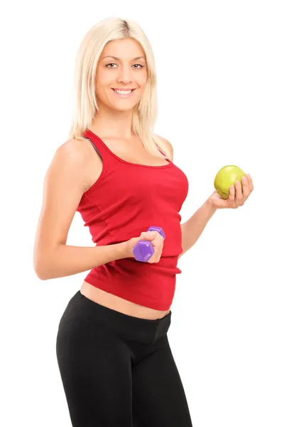 Female athlete holding dumbbell — Stock Photo, Image