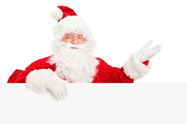 Weihnachtsmann hinter Reklametafel — Stockfoto