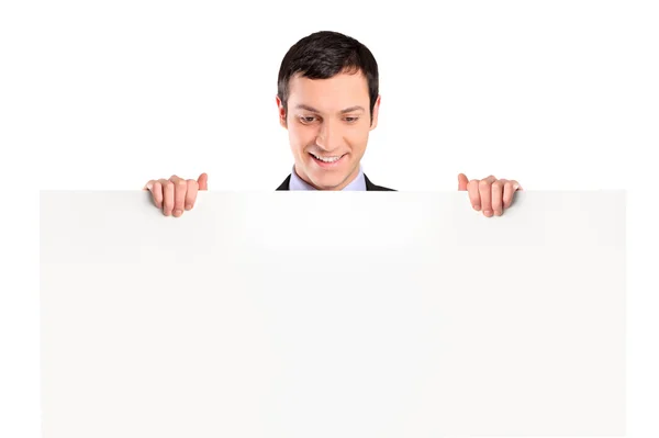 Businessman looking at white banner — Stock Photo, Image