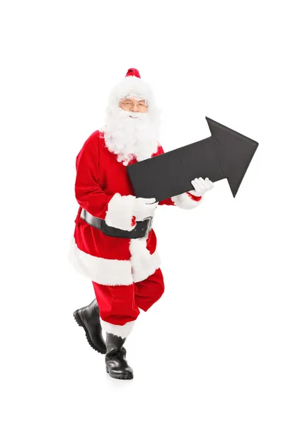 Sonriente Santa Claus sosteniendo la flecha —  Fotos de Stock